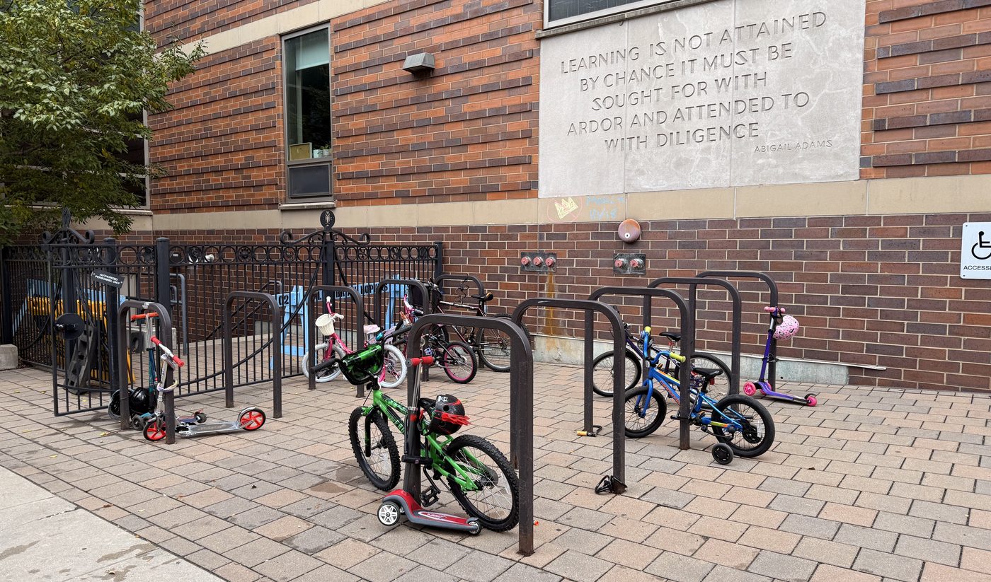 Bikes and scooters locked at the racks outside the East Campus